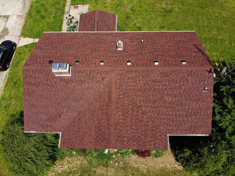 An aerial shot of an Erie Home Asphalt Shingle that is in the Monaco Red color.