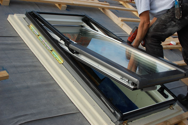 A installer assembling a Roof Skylight Window.