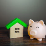 Satisfied piggy bank near the house. Low cost utilities and high energy efficiency.