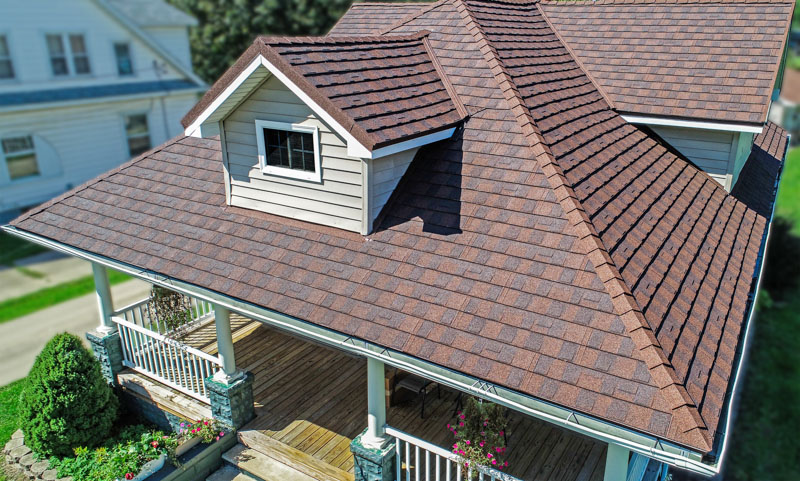 A Beautiful Erie Home Metal Roof featuring Charcoal Pacific Tile Shingles