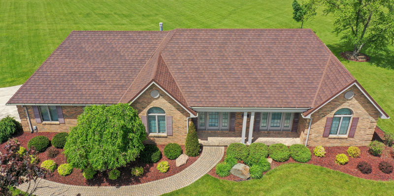 A Beautiful Erie Home Metal Roof featuring Barclay Metal Granite Ridge Shingles