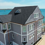 A Beautiful Erie Home Metal Roof featuring Charcoal Granite Ridge Shingles