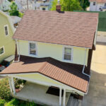 A Beautiful Erie Home Metal Roof featuring a Barclay Metal Roof