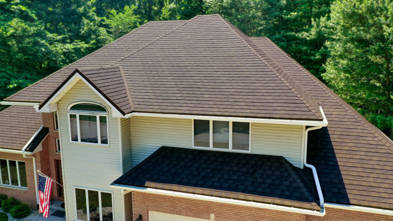 A Beautiful Erie Home Metal Roof featuring a Timberwood Shingles.