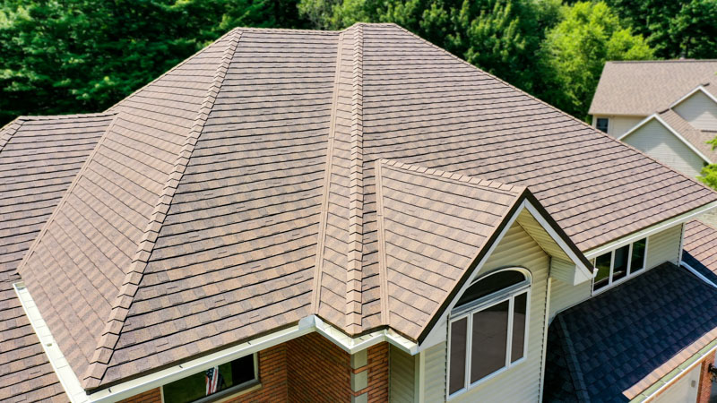 A Beautiful Erie Home Metal Roof featuring a Timberwood Roof