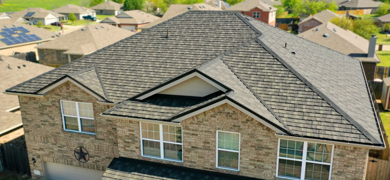 A Beautiful Erie Home Metal Roof featuring a Charcoal HD-Cottage Roof