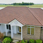 A Beautiful Erie Home Metal Roof featuring a Barclay Pacific Tile Roof.