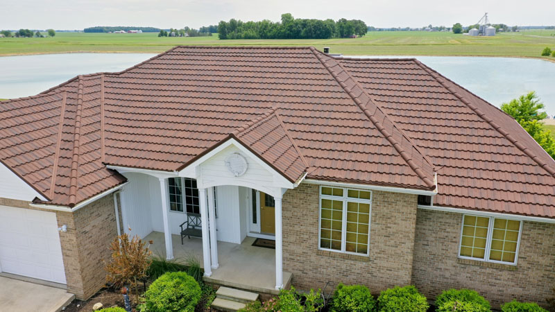 A Beautiful Erie Home Metal Roof featuring a Barclay Pacific Tile Roof.