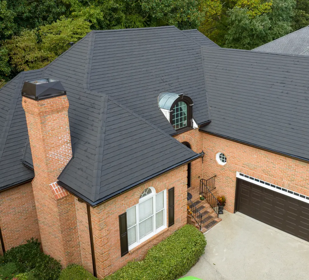 Red Brick Home with Metal Roof, Charcoal