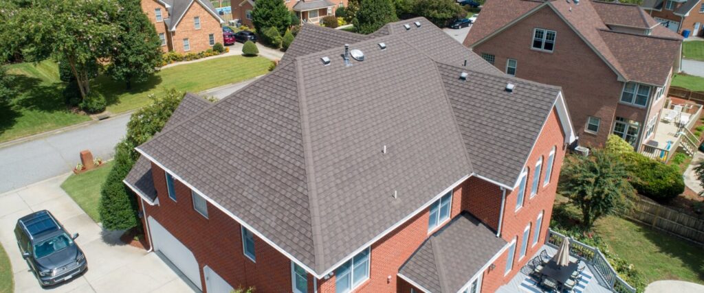 Red Brick Home with Metal Roof, Timberwood