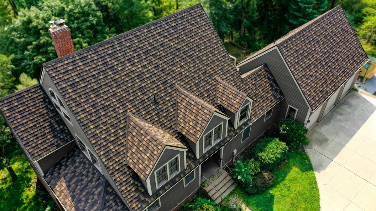 An aerial shot of an Timberwood Cottage HD metal roof.