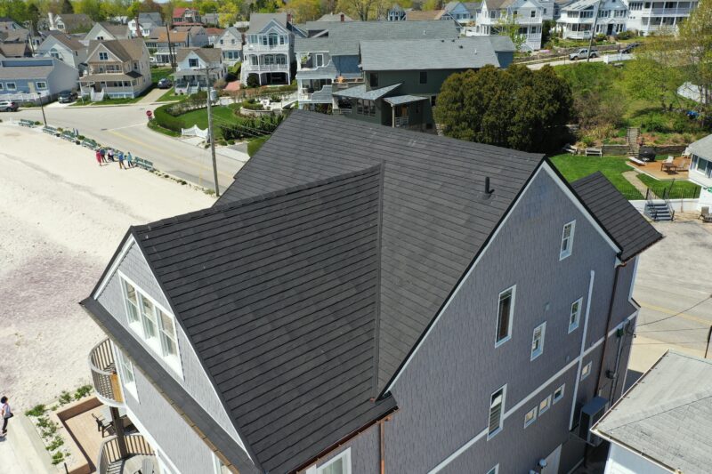 black metal roof on a gray home