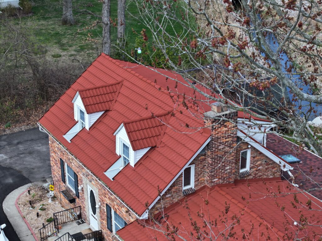 red metal roof on brick house