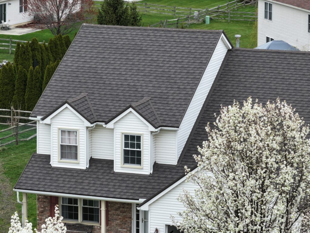 dark gray metal roof on a white home