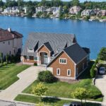 metal roof on a brown house by the lake