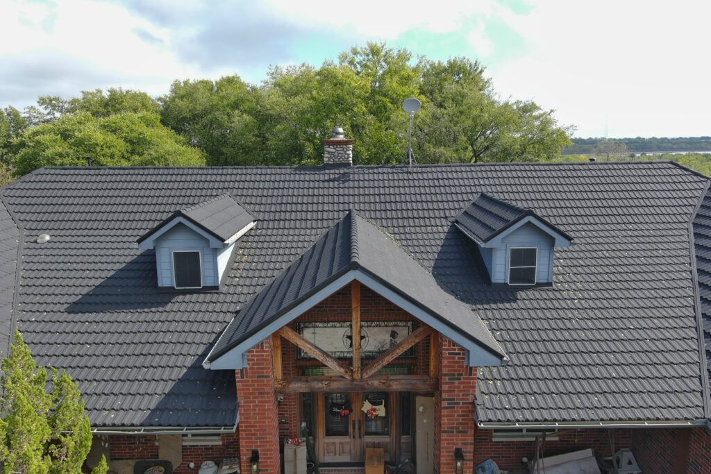 dark gray metal roof on brick home