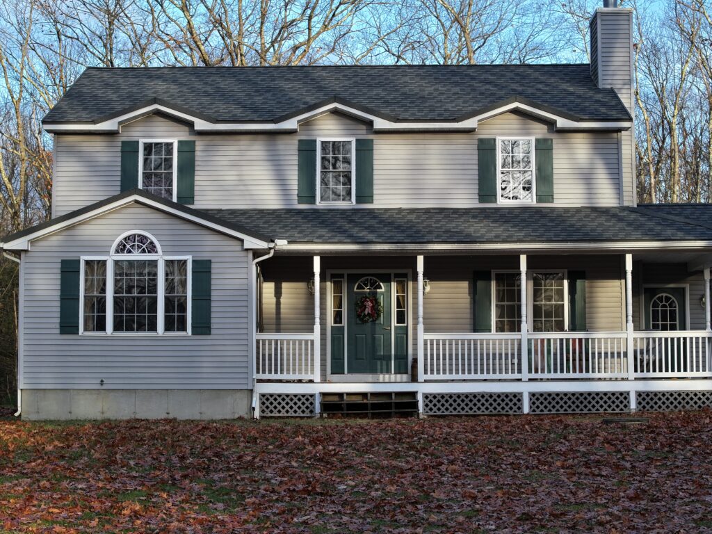 default dark gray metal roof on light gray house