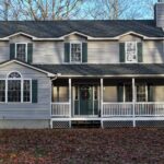 dark gray metal roof on light gray house