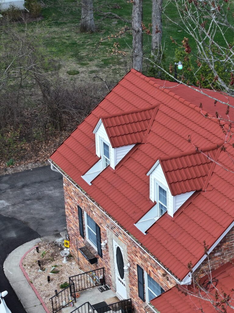 default red metal roof on brick house
