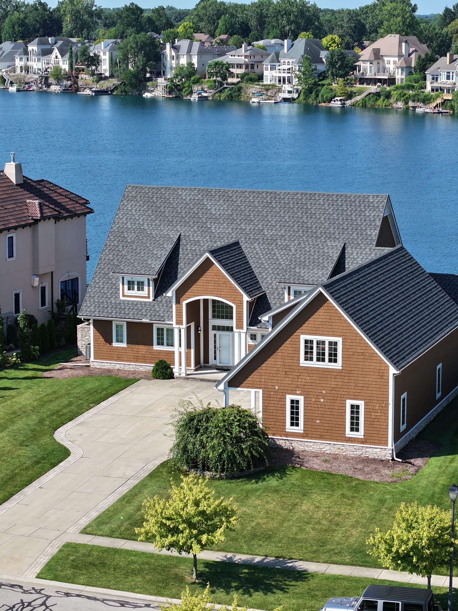 default metal roof on a brown house by the lake